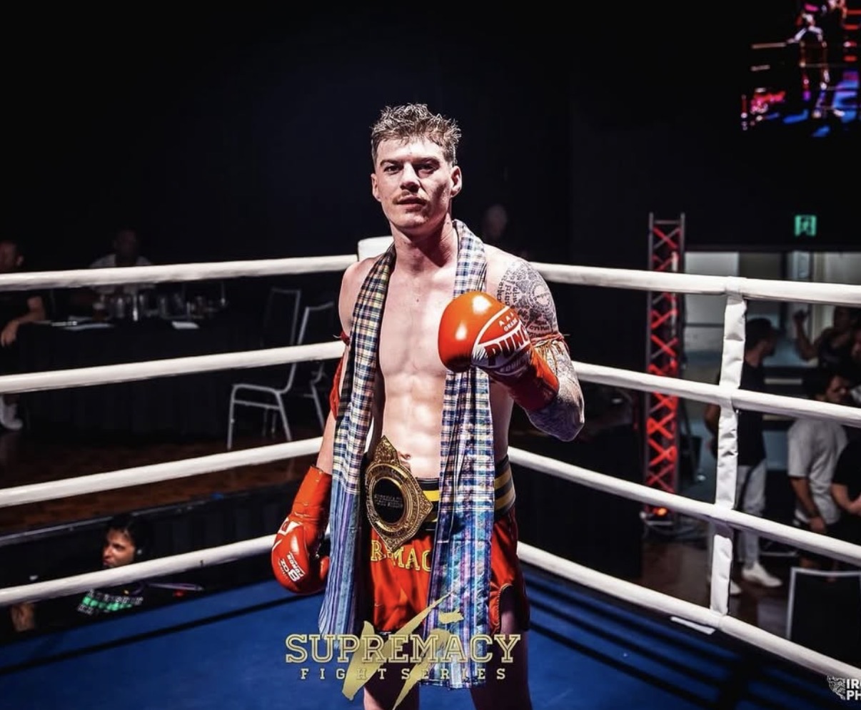 Bailey Collins in the ring with his championship belt